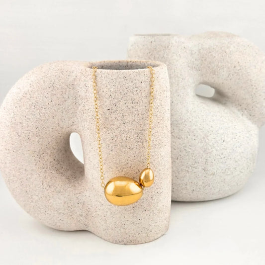 the - ora   necklace