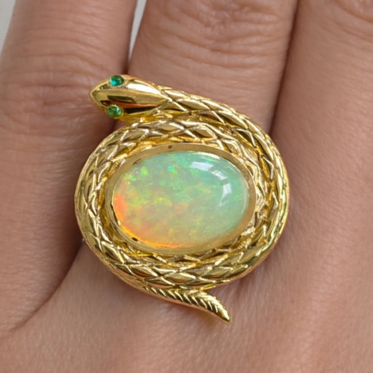 protection snake ring natural ethiopian opal emerald eyes