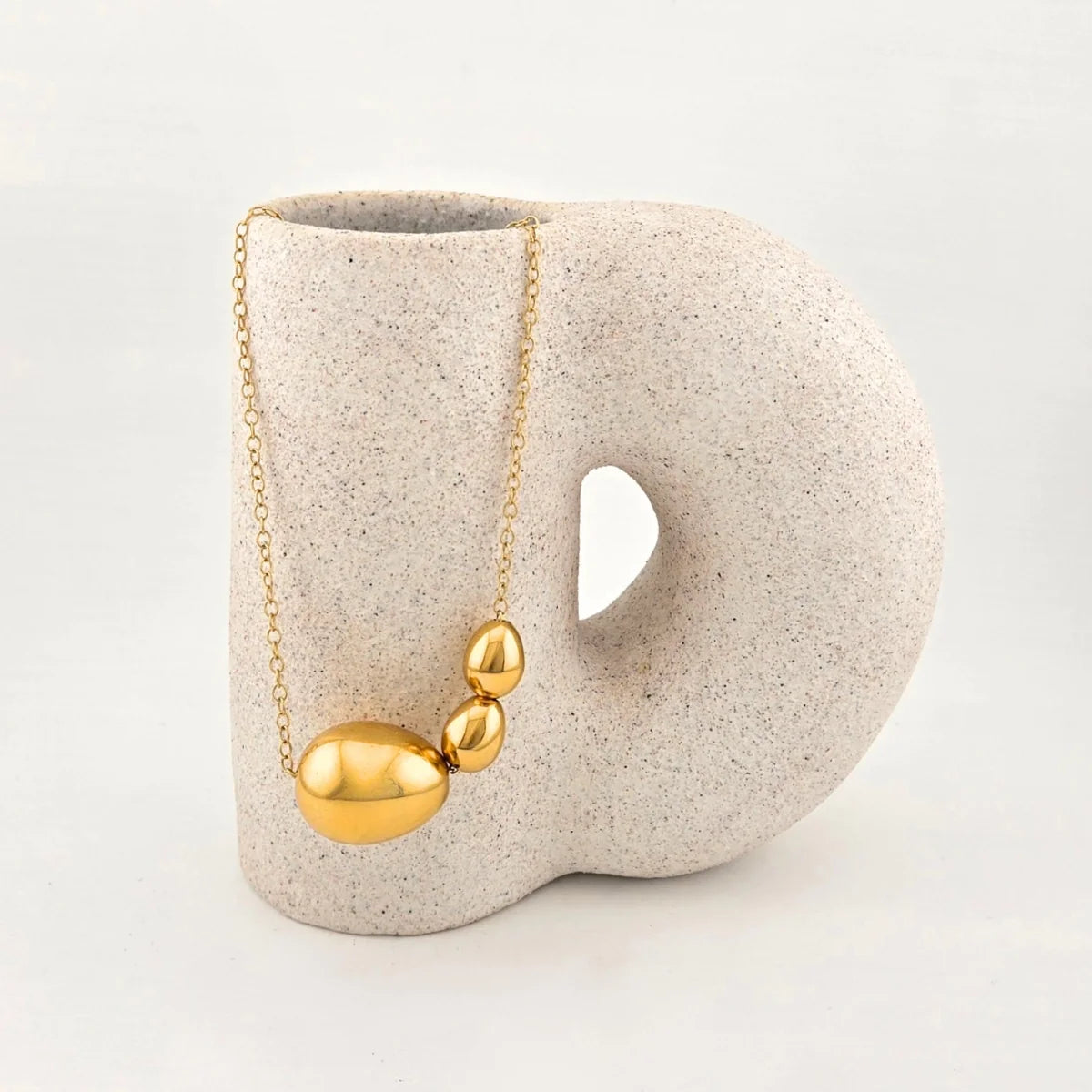 the - ora   necklace
